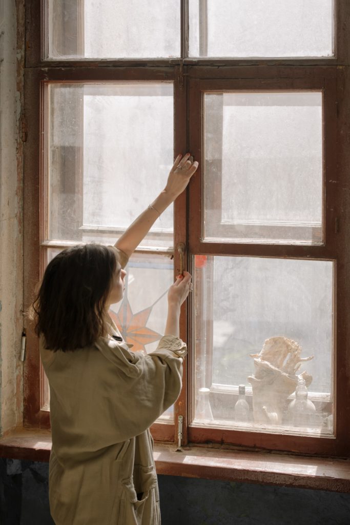 Woman-Fixing-Window